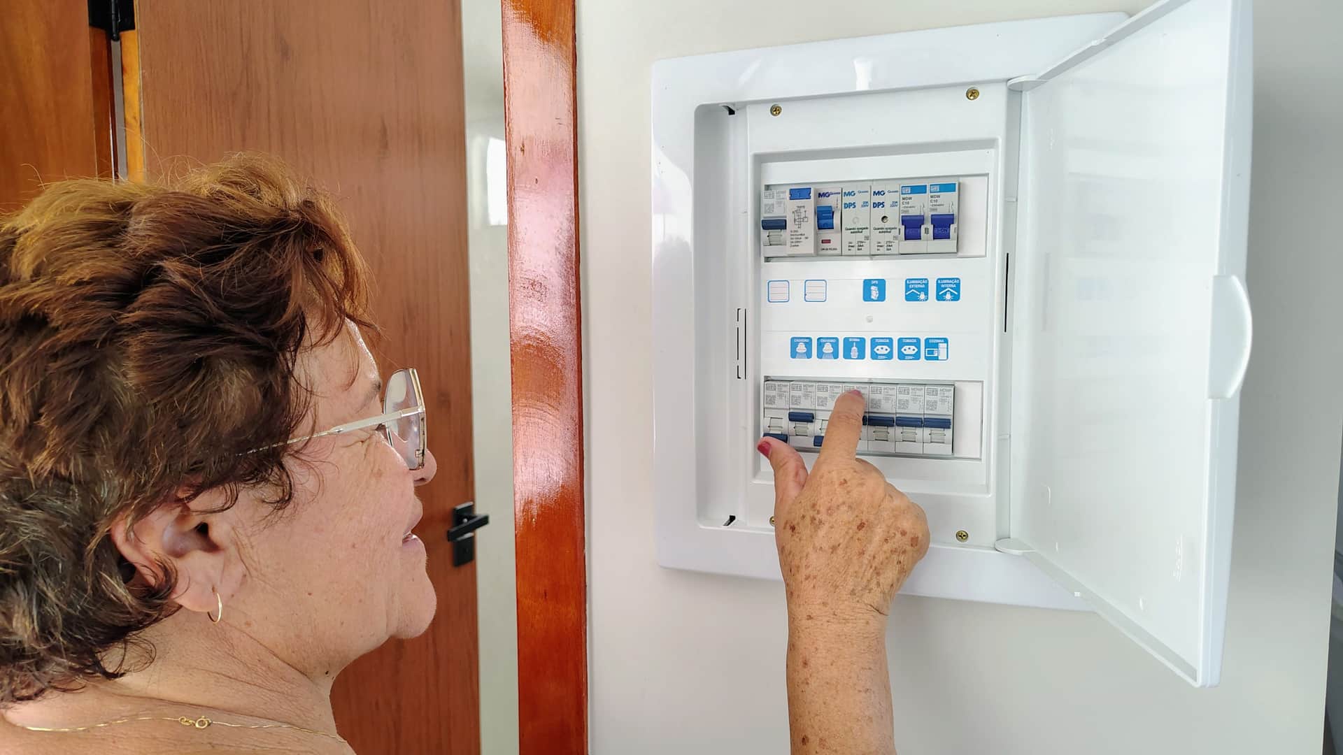 An open home electrical panel with circuit breakers