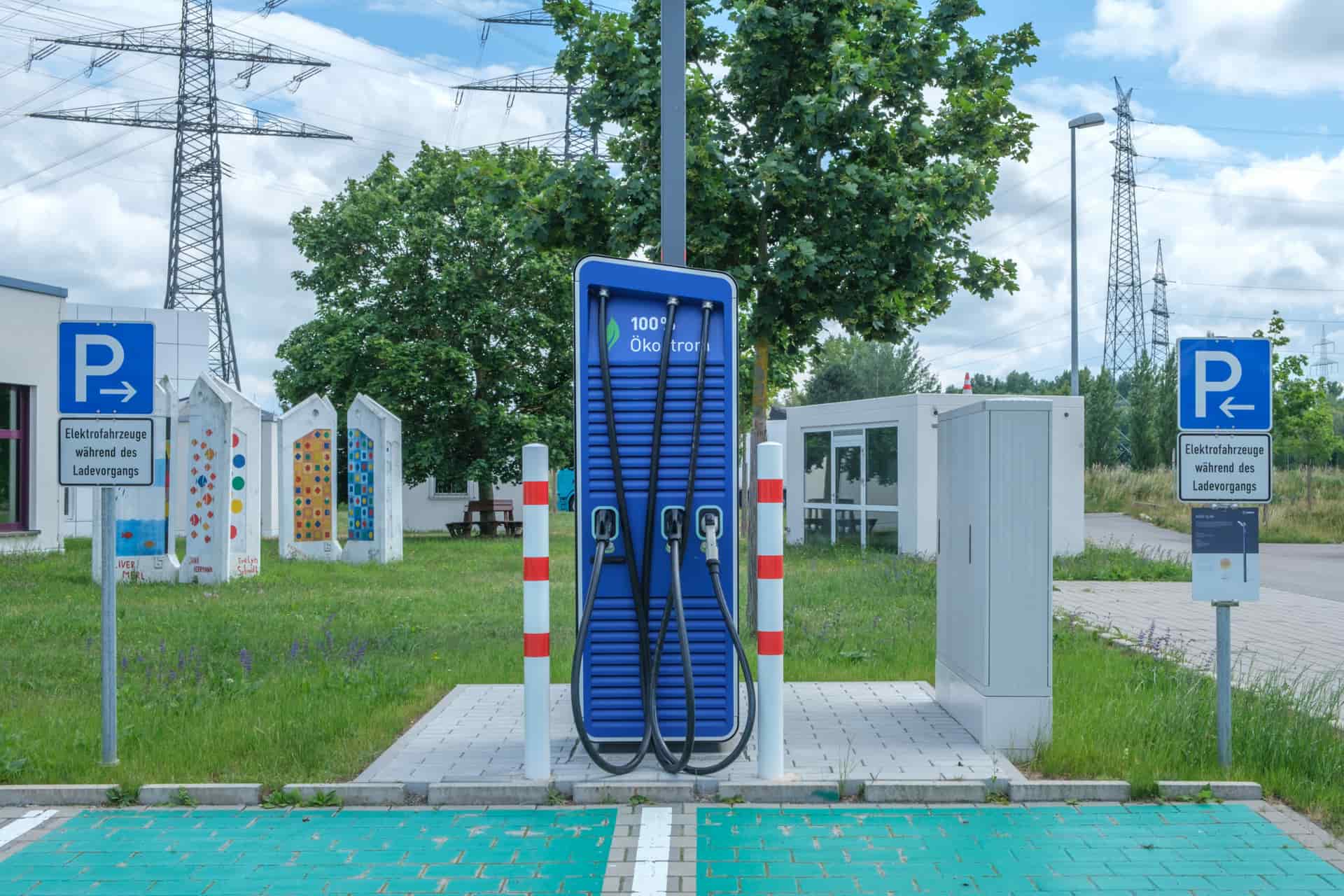An electric vehicle charging at a public charging station